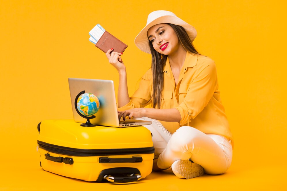 woman-planning-trip-laptop-while-holding-plane-tickets-passport_23-2148434385